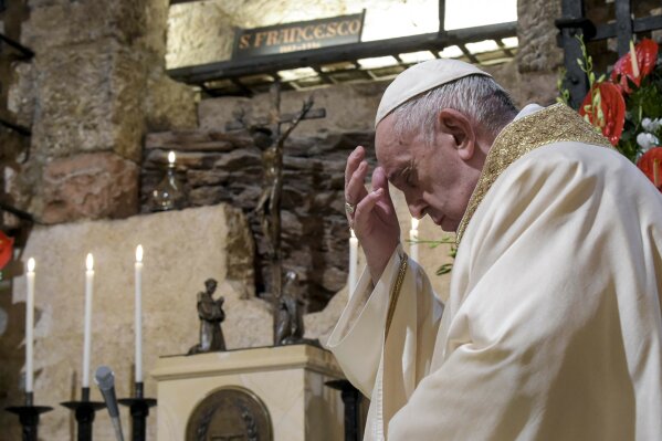 Pope Francis celebrates Mass in the crypt of the Basilica of St. Francis, in Assisi, Italy, Saturday, Oct. 3, 2020. Pope Francis travelled to the homeland of his nature-loving namesake on Saturday to sign an encyclical laying out his vision of a post-COVID world built on solidarity, fraternity and care for the environment.
In his first outing from Rome since the coronavirus lockdown, Francis celebrated Mass on Saturday in the crypt of the Basilica of St. Francis in the Umbrian hilltop town of Assisi. (Vatican Media via AP)