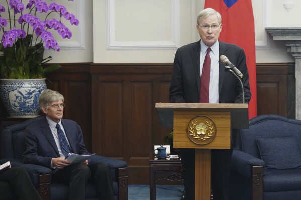 Former U.S. Deputy Secretary of State James Steinberg, left, looks on as former U.S. National security advisor Stephen Hadley speaks during a meeting with Taiwan's President Tsai Ing-wen, unseen, at the Presidential Office in Taipei, Taiwan on Monday, Jan. 15, 2024. (ADen Hsu/Pool Photo via AP)