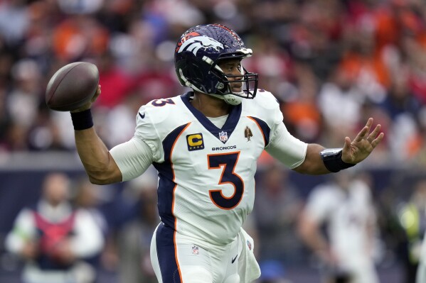 Denver Broncos quarterback Russell Wilson passes against the Houston Texans in the first half of an NFL football game Sunday, Dec. 3, 2023, in Houston. (AP Photo/Eric Christian Smith)