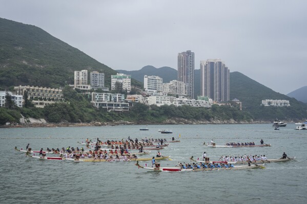 Competitors take part in the Stanley International Dragon Boat Championships to celebrate the Dragon Boat Festival in Hong Kong, Saturday, May 31, 2025. (AP Photo/Chan Long Hei)