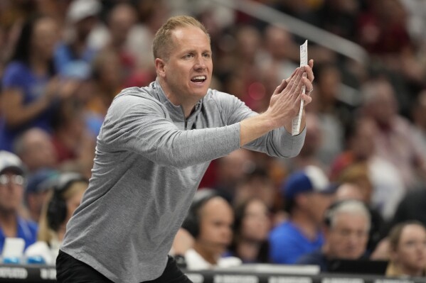 Brigham Young head coach Kevin Young is seen on the sidelines during the second half of an NCAA college basketball game against Iowa State in the quarterfinal round of the Big 12 Conference tournament, Thursday, March 13, 2025, in Kansas City, Mo. (AP Photo/Charlie Riedel)