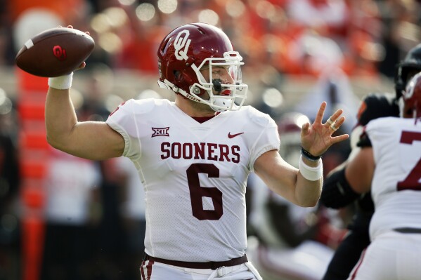 FILE - Oklahoma quarterback Baker Mayfield (6) looks to throw in the first half of an NCAA college football game against Oklahoma State in Stillwater, Okla., Nov. 4, 2017. Oklahoma and Oklahoma State will meet on Saturday for the final time before Oklahoma leaves the Big 12 for the Southeastern Conference. (AP Photo/Sue Ogrocki, File)