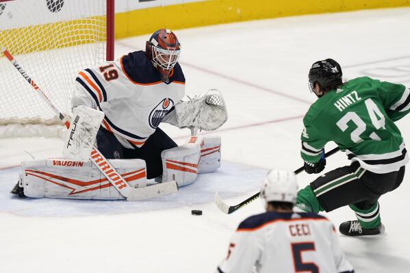 Dallas Stars center Roope Hintz (24) shoots, scoring against Edmonton Oilers goaltender Mikko Koskinen (19) during the third period of an NHL hockey game in Dallas, Tuesday, March 22, 2022. The Stars won 5-3. (AP Photo/LM Otero)