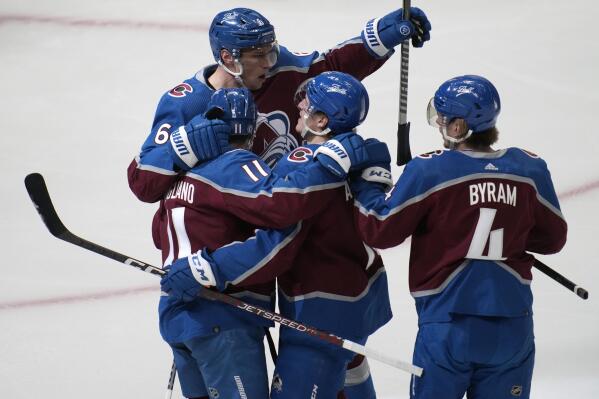 Colorado Avalanche right wing Nicolas Aube-Kubel, second from right, is congratulated on his goal by, from far left, defenseman Erik Johnson, center Andrew Cogliano and defenseman Bowen Byram during the first period of the team's NHL hockey game against the Los Angeles Kings on Wednesday, April 13, 2022, in Denver. (AP Photo/David Zalubowski)