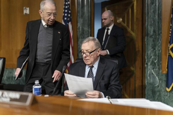 FILE - Sen. Chuck Grassley, R-Iowa, left, the ranking member, confers with Sen. Dick Durbin, D-Ill., chairman of the Senate Judiciary Committee, at the Capitol in Washington, Feb. 17, 2022. The leaders of the Senate Judiciary Committee are demanding Attorney General Merrick Garland take immediate action to reform the beleaguered federal Bureau of Prisons. It comes in response to Associated Press investigations that exposed widespread problems at the bureau, serious misconduct involving correctional officers and rampant sexual abuse at a California women’s prison. (AP Photo/J. Scott Applewhite, File)