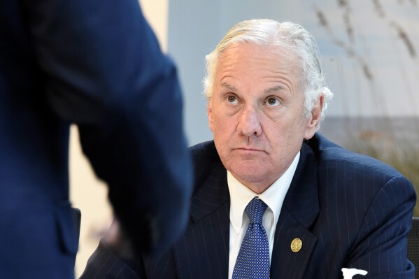 FILE - South Carolina Gov. Henry McMaster listens to a presentation, Aug. 6, 2021, at Charles River Labs in Charleston, S.C. McMaster wrote a letter to state senators on Monday, Oct. 16, 2023, telling them he will require candidates to be magistrates to reveal more information about their finances, political donations and other activities. (AP Photo/Meg Kinnard, File)