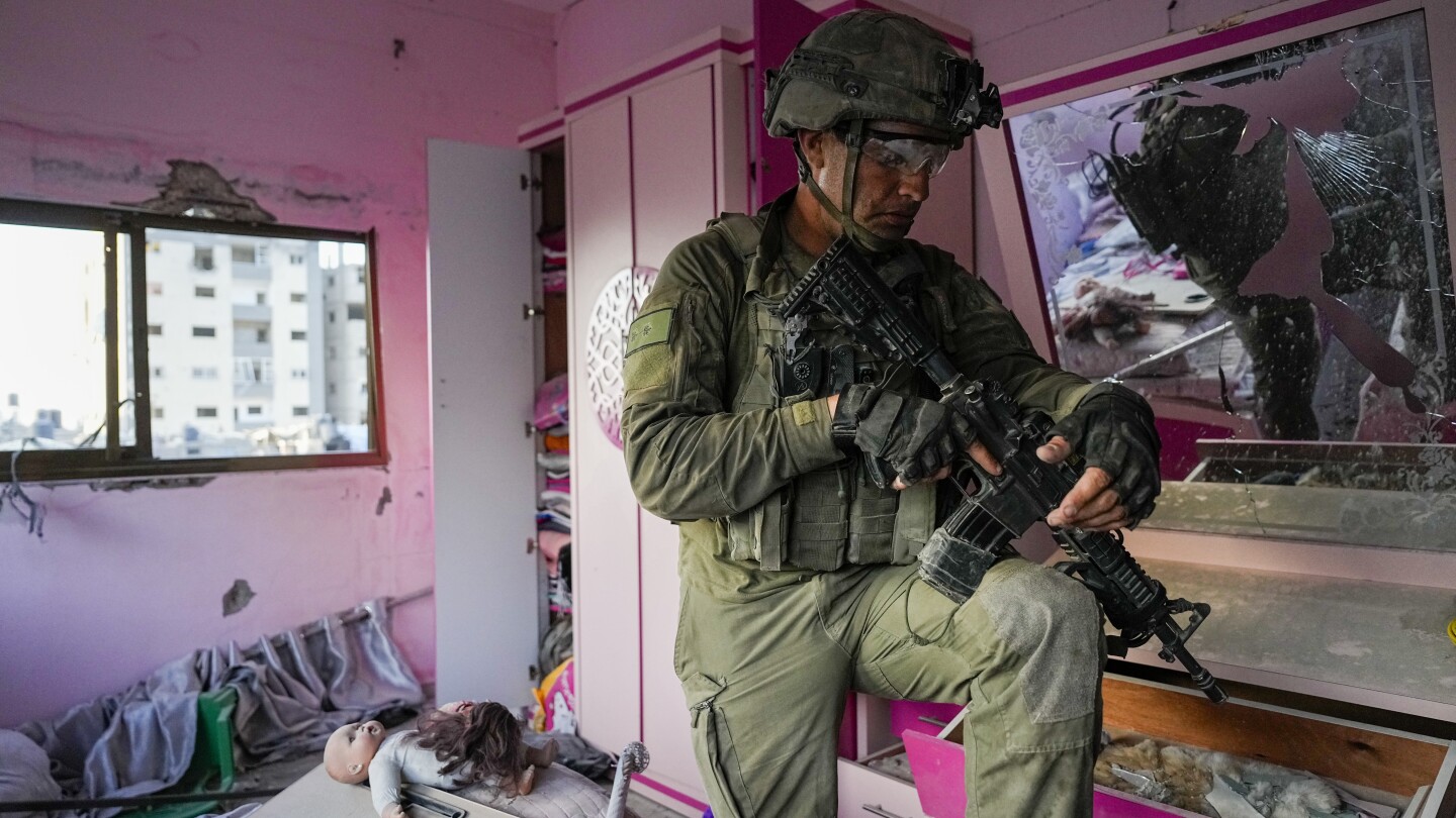 Israeli military tour of northern Gaza reveals ravaged buildings, toppled trees, former weapons lab