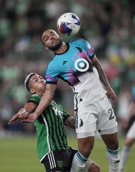 Minnesota United defender D.J. Taylor (27) works with the ball next to Austin FC midfielder Daniel Pereira, left, during the second half of an MLS soccer match Wednesday, May 31, 2023, in Austin, Texas. (AP Photo/Eric Gay)