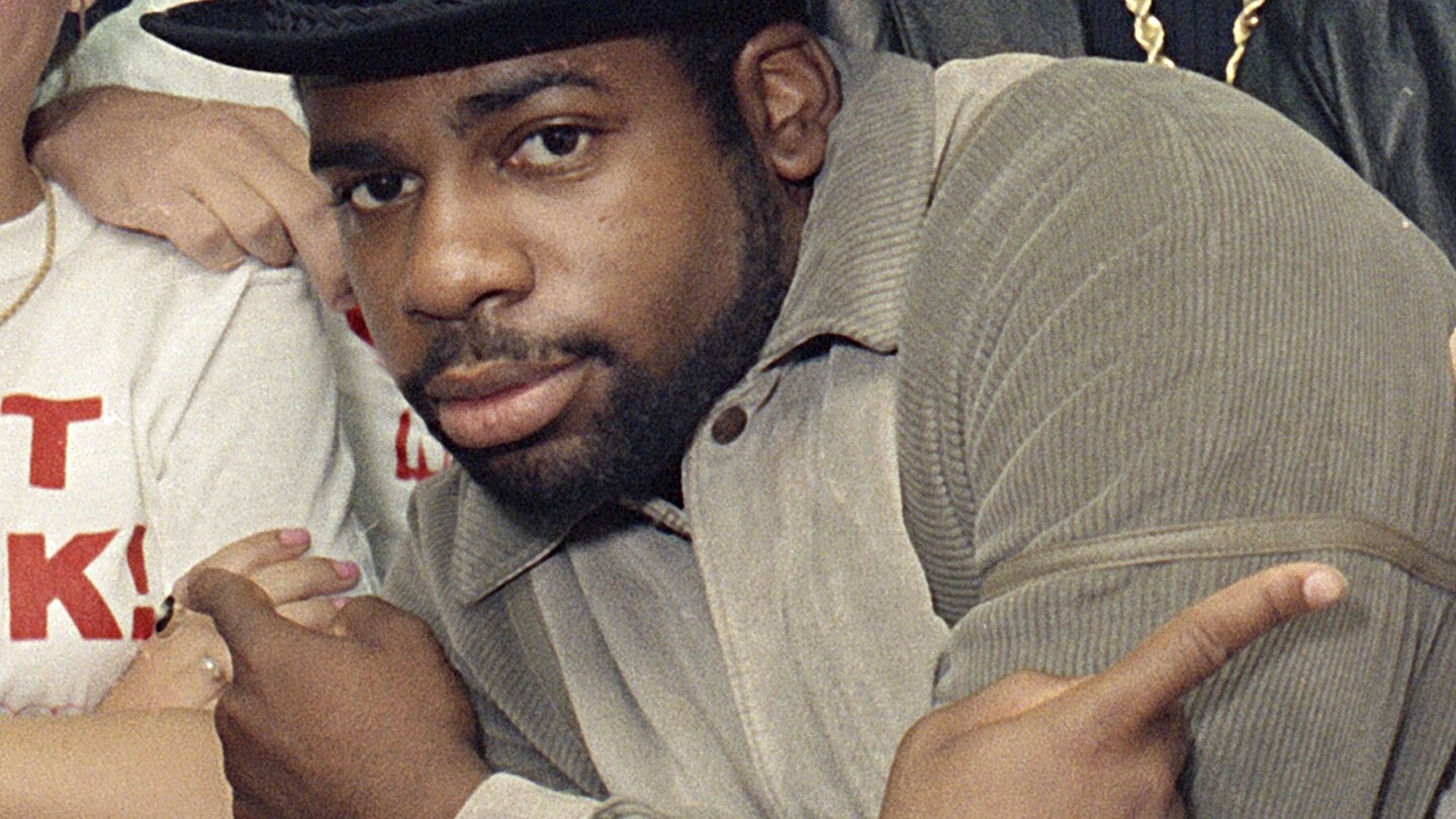 FILE -Run-D.M.C.'s Jason Mizell, Jam-Master Jay, poses with teenagers gathered at New York's Madison Square Garden, Oct. 7, 1986, in New York. Two men were convicted of murder Tuesday, Feb. 27, 2024 in the death of Run-DMC star Jam Master Jay, a brazen 2002 shooting in the rap legend's studio. An anonymous Brooklyn federal jury delivered the verdict in the trial of Karl Jordan Jr. and Ronald Washington.(AP Photo/G. Paul Burnett, File)