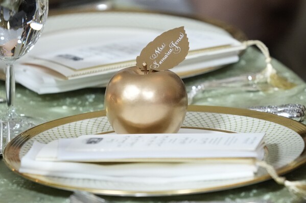 A golden apple is a gift for the honored teachers during a State Dinner at the White House in Washington, Thursday, May 2, 2024, to honor the 2024 National Teacher of the Year and other teachers from across the United States. (AP Photo/Susan Walsh)