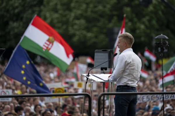 Péter Magyar, a rising challenger to Hungarian Prime Minister Viktor Orbán, addresses people at a campaign rally in the rural city of Debrecen, Hungary, on Sunday, May 5, 2024. Magyar, whose TISZA party is running in European Union elections, has managed to mobilize large crowds of supporters on a campaign tour of Hungary's heartland, a rarity for an Orbán opponent. (AP Photo/Denes Erdos)