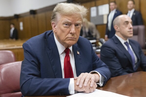 Former U.S. President Donald Trump sits inside a Manhattan criminal court in New York, on Monday, April 15, 2024. The hush money trial of former President Trump begins Monday with jury selection. It's a singular moment for American history as the first criminal trial of a former U.S. commander in chief. (Jeenah Moon/Pool Photo via AP)