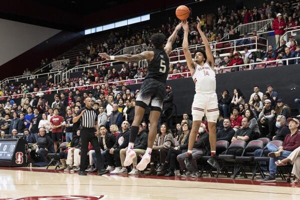 Stanford forward Spencer Jones (14) shoots over Washington guard Jamal Bey (5) during the first half of an NCAA college basketball game in Stanford, Calif., Sunday, Feb. 26, 2023. (AP Photo/John Hefti)