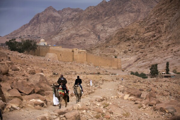 Visitors leave Saint Catherine's Monastery in Saint Catherine, Egypt, Dec. 9, 2013. (AP Photo/Hiro Komae, File)