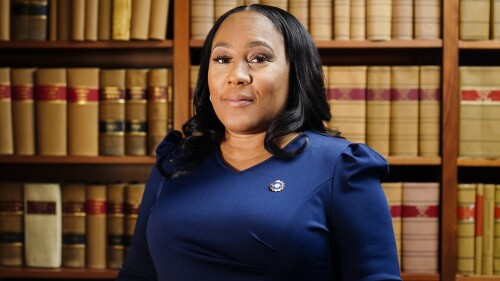 FILE - Fulton County District Attorney Fani Willis poses for a portrait, April 19, 2023, in Atlanta. A new grand jury being seated this week in Atlanta will likely consider whether criminal charges are appropriate for former President Donald Trump or his allies for their efforts to overturn his 2020 election loss in Georgia. Willis has been investigating since shortly after Trump called Georgia Secretary of State Brad Raffensperger to ask him to find just enough votes to beat Democrat Joe Biden. (AP Photo/Brynn Anderson, File)