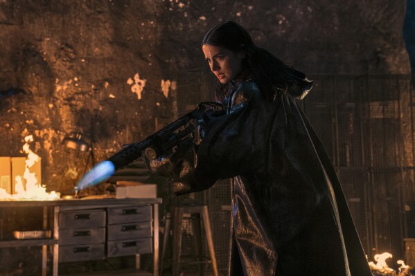 This image released by Lionsgate shows Ana de Armas in a scene from "Ballerina." (Lionsgate via AP)