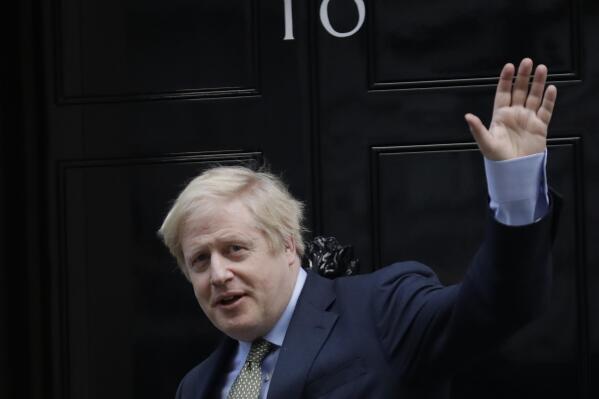 FILE - Britain's Prime Minister Boris Johnson returns to 10 Downing Street after meeting with Queen Elizabeth II at Buckingham Palace, London, on Friday, Dec. 13, 2019. Former U.K. Prime Minister Johnson says he’s quitting as a lawmaker after being told he will be sanctioned for misleading Parliament. Johnson quit on Friday, June 9, 2023 after receiving the results of an investigation by lawmakers over misleading statements he made to Parliament about a slew of gatherings in government that breached pandemic lockdown rules.(AP Photo/Matt Dunham, File)
