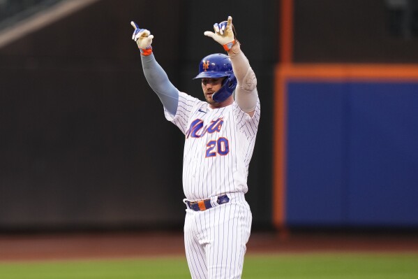 New York Mets' Pete Alonso gestures to teammates after hitting a double during the sixth inning in the first baseball game of a doubleheader against the Miami Marlins, Wednesday, Sept. 27, 2023, in New York. (AP Photo/Frank Franklin II)