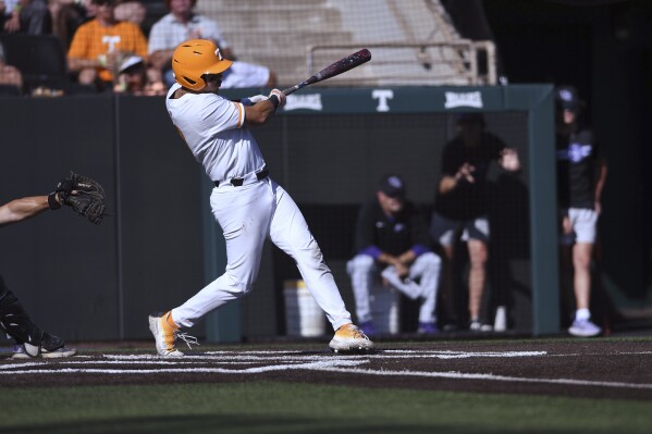 Tennessee's Hunter Ensley (9) hits a home run against Evansville during the seventh inning of an NCAA college baseball tournament super regional game Friday, June 7, 2024, in Knoxville, Tenn. (Scott Keller/The Daily Times via AP)