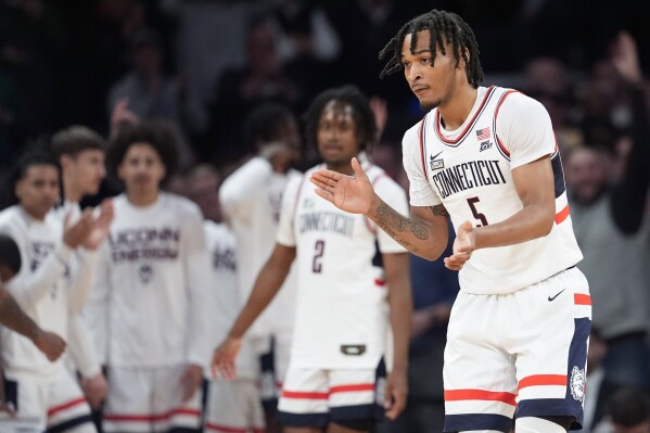 UConn guard Stephon Castle (5) reacts during the first half of an NCAA college basketball game against Marquette in the championship of the Big East Conference tournament, Saturday, March 16, 2024, in New York. (AP Photo/Mary Altaffer)