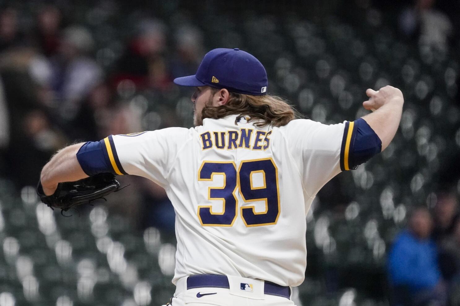 Arrieta battered by Brewers while Burnes dominates