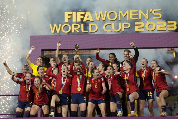 Team Spain celebrates after winning the Women's World Cup soccer final against England at Stadium Australia in Sydney, Australia, Sunday, Aug. 20, 2023. (AP Photo/Alessandra Tarantino)