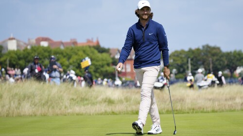 England's Tommy Fleetwood smiles after a birdie putt on the 16th hole on the first day of the British Open Golf Championships at the Royal Liverpool Golf Club in Hoylake, England, Thursday, July 20, 2023. (AP Photo/Jon Super)