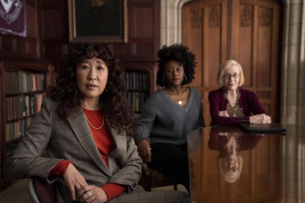 This image released by Netflix shows Sandra Oh, from left, Nana Mensah and Holland Taylor in a scene from "The Chair." (Eliza Morse/Netflix via AP)