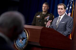 Pentagon spokesman John Kirby, accompanied by U.S. Army Major Gen. William Taylor, Joint Staff Operations, left, speaks during a briefing at the Pentagon in Washington, Friday, Aug. 20, 2021. (AP Photo/Andrew Harnik)