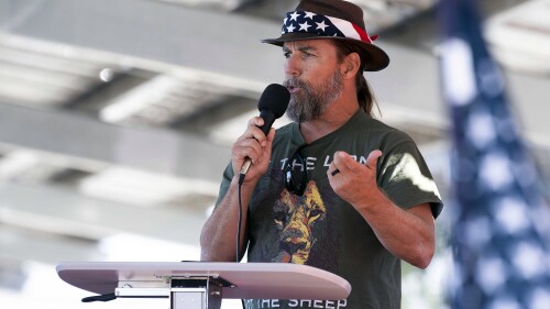 FILE - Alan Hostetter speaks during a pro-Trump election integrity rally he organized at the Orange County Registrar of Voters offices in Santa Ana, Calif., Nov. 9, 2020. A former California police chief was convicted on Thursday, July 13, 2023, of joining the riot at the U.S. Capitol with a hatchet in his backpack and plotting to stop Congress from certifying President Joe Biden's 2020 electoral victory. A judge in Washington's federal court heard testimony without a jury before convicting Hostetter, a right-wing activist and vocal critic of COVID-19 restrictions who defended himself at his bench trial with help from a standby attorney. (Paul Bersebach/The Orange County Register via AP, File)