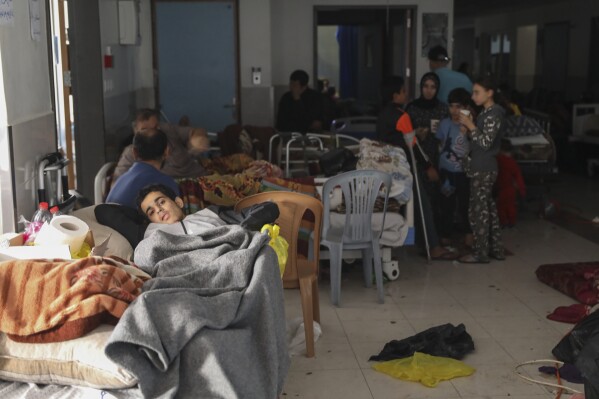 Wounded Palestinians lie in Shifa Hospital in Gaza City on Friday, Nov. 24, 2023, as the temporary ceasefire between Israel and Hamas took effect. (AP Photo/Mohammed Hajjar)