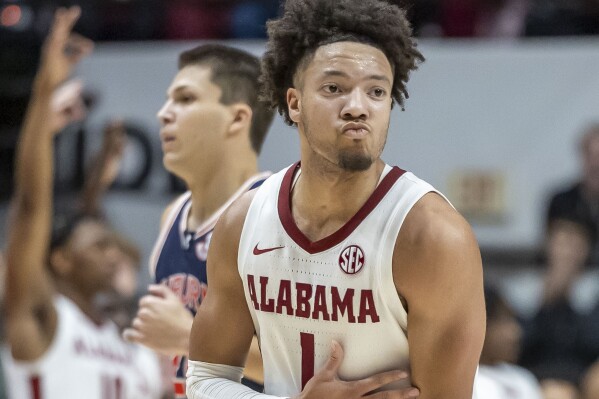 Alabama guard Mark Sears (1) celebrates a 3-point shot during the second half of the team's NCAA college basketball game against Auburn, Wednesday, Jan. 24, 2024, in Tuscaloosa, Ala. (AP Photo/Vasha Hunt)