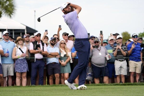 Scottie Scheffler hits a shot from the 15th tee during the final round of the Arnold Palmer Invitational golf tournament Sunday, March 10, 2024, in Orlando, Fla. (AP Photo/John Raoux)