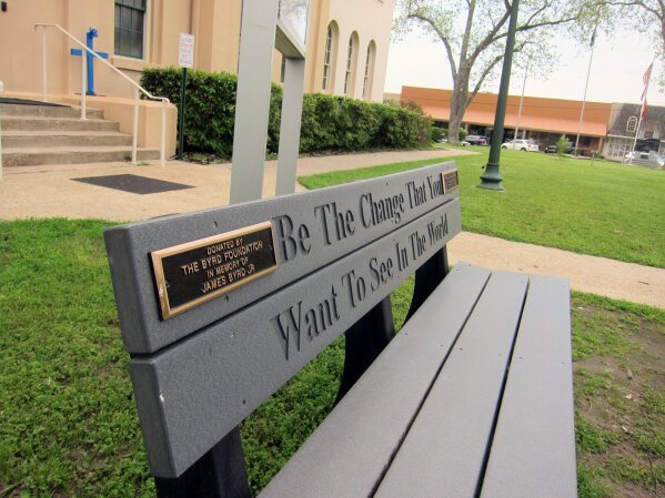 
              This April 12, 2019, photo shows a bench donated by a foundation started by the family of James Byrd Jr. in Jasper, Texas. The bench is located in front of the county courthouse in Jasper, Texas, where two of the three men convicted for Byrd's death, considered one of the most gruesome hate crime murders in recent Texas history, were tried. John William King, the convicted ringleader of Byrd's death, is set to be executed on Wednesday, April. 24, 2019. (AP Photo/Juan Lozano)
            