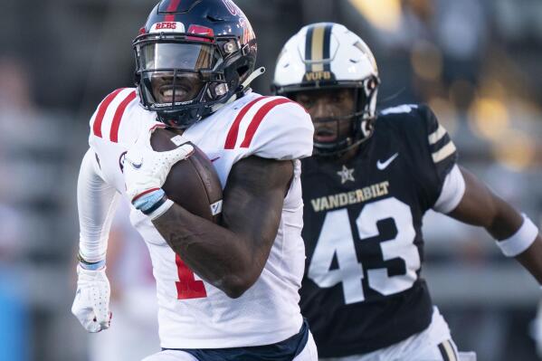 Mississippi wide receiver Jonathan Mingo (1) races up the field with a 71-yard touchdown reception, past Vanderbilt linebacker De'Rickey Wright (43) during the third quarter of an NCAA college football game Saturday, Oct. 8, 2022, in Nashville, Tenn. (George Walker IV/The Tennessean via AP)