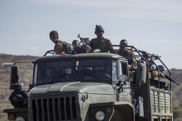 FILE - Ethiopian government soldiers ride in the back of a truck on a road near Agula, north of Mekele, in the Tigray region of northern Ethiopia on May 8, 2021. Authorities in Ethiopia's northern Tigray region alleged Wednesday, Aug. 24, 2022 that Ethiopia's military launched a "large-scale" offensive for the first time in a year, while Ethiopia's military spokesman did not immediately respond to questions. (AP Photo/Ben Curtis, File)