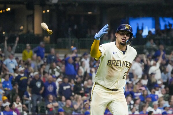 Milwaukee Brewers' Willy Adames reacts after hitting a two-run home run during the seventh inning of a baseball game against the Chicago Cubs Wednesday, May 29, 2024, in Milwaukee. (AP Photo/Morry Gash)
