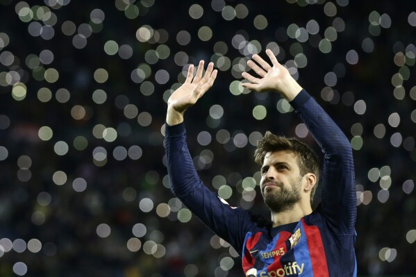 FILE - Barcelona's Gerard Pique waves to supporters at the end of Spanish La Liga soccer match between Barcelona and Almeria at the Camp Nou stadium in Barcelona, Spain, Saturday, Nov. 5, 2022. A Spanish judge expanded her investigation into the Spanish soccer federation's deal to take the Spanish Super Cup to Saudi Arabia to include former player Gerard Piqué on Thursday, May 30, 2024. (AP Photo/Joan Monfort, File)