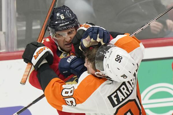 Philadelphia Flyers left wing Joel Farabee (86) and Florida Panthers center Colin White (6) scuffle during the second period of an NHL hockey game, Wednesday, Oct. 19, 2022, in Sunrise, Fla. (AP Photo/Wilfredo Lee )