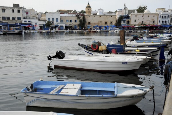 FILE - A view of the port of Bizerte, Tunisia, where boats similar to the ones used by migrants to reach Italy are docked, Wednesday, Sept. 23, 2020. Tunisia's coast guard retrieved the bodies of nine people who died after their boat sank on Thursday, Feb. 15, 2024, marking the latest disaster for a surging number of migrants trying to cross the Mediterranean Sea to Europe. (AP Photo/Hassene Dridi, File)