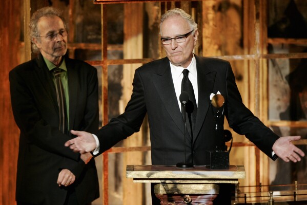 FILE - Jerry Moss, right, and Herb Alpert, co-founders of A&M Records, appear during their induction into the Rock & Roll Hall of Fame in New York on March 13, 2006. Moss, a music industry giant who co-founded A&M Records, died Wednesday at his home in Bel Air, Calif. He was 88. (AP Photo/Jeff Christensen, File)