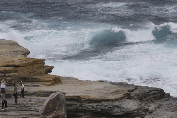 Waves hit the shore in Shirahama, Wakayama prefecture, western Japan Monday, Aug. 14, 2023. A storm that used to be a typhoon has made a landfall at Japan's central region Tuesday and hitting large areas of western Japan with heavy rain and high winds. (Kyodo News via AP)