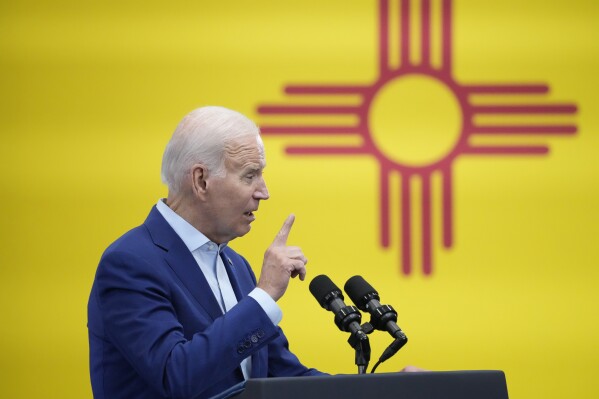 President Joe Biden stands in front of the flag of New Mexico as he speaks at the Arcosa Wind Towers, Wednesday, Aug. 9, 2023, in Belen, N.M. Biden is making the case that his policies of financial and tax incentives have revived U.S. manufacturing. (AP Photo/Alex Brandon)