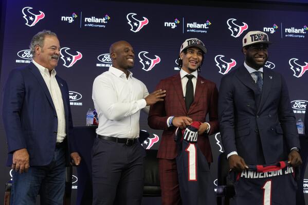 From left to right, Houston Texans CEO Cal McNair and head coach DeMeco Ryans laugh with quarterback C.J. Stroud and linebacker Will Anderson Jr. during an introductory news conference, Friday, April 28, 2023, in Houston. Stroud and Anderson Jr. were selected in the first round by the Texans in the NFL football draft Thursday. (AP Photo/Kevin M. Cox)
