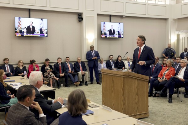 Virginia Gov. Glenn Youngkin speaks at a joint meeting of the legislature's money committees to talk about the state's revenues at the Pocahontas Building in Richmond, Va., on Wednesday, Aug. 23, 2023. (Daniel Sangjib Min/Richmond Times-Dispatch via AP)
