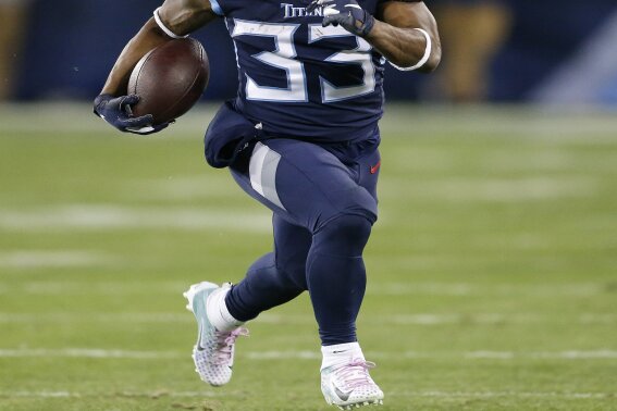 FILE - In this Dec. 6, 2018, file photo, Tennessee Titans running back Dion Lewis (33) runs against the Jacksonville Jaguars during the first half of an NFL football game in Nashville, Tenn. Lewis is in a very familiar role being Saquon Barkley's backup with the New York Giants. It's a role Lewis occupied the past two seasons in Tennessee, spelling NFL rushing leader Derrick Henry. (AP Photo/James Kenney, File)