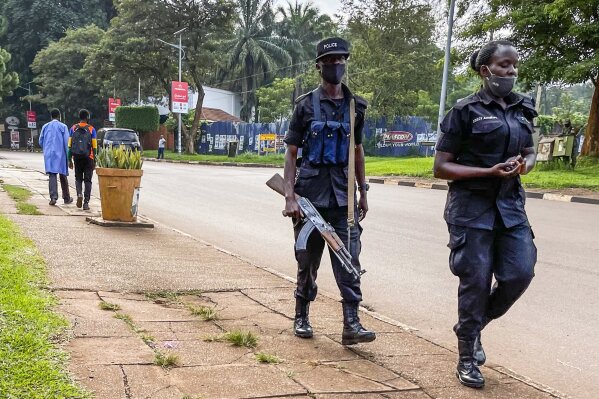 Security forces patrol in Kampala, Uganda Wednesday, Jan. 13, 2021.The United States ambassador to Uganda said Wednesday the embassy has canceled plans to observe the country's tense presidential election on Thursday, citing a decision by electoral authorities to deny accreditation to most members of the observation team.(AP Photo/Jerome Delay)