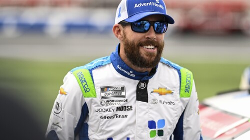 FILE - Ross Chastain smiles prior to a NASCAR Cup Series auto race at Charlotte Motor Speedway, May 29, 2023, in Concord, N.C. Ty Norris has heard NASCAR fans both cheer and boo Chastain. The president of Trackhouse Racing also wishes NASCAR had 40 drivers just like the man nicknamed the “Melon Man
