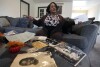 Tracy Brooks, an auto worker retiree is interviewed as she shows off vintage photos of her family, Wednesday, Oct. 18, 2023, in Romulus, Mich. She and her father, and grandfather and daughter all worked on assembly lines for one or more of Detroit's automakers. 