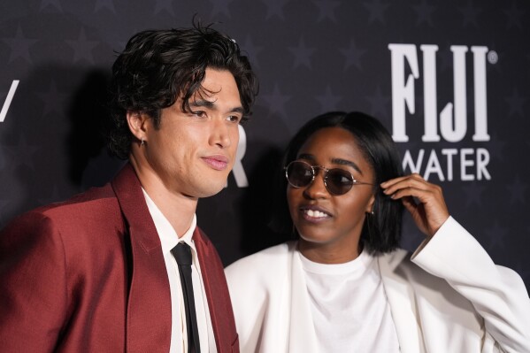 Charles Melton, left, and Ayo Edebiri attend the 29th Critics Choice Awards on Sunday, Jan. 14, 2024, at the Barker Hangar in Santa Monica, Calif. (AP Photo/Chris Pizzello)